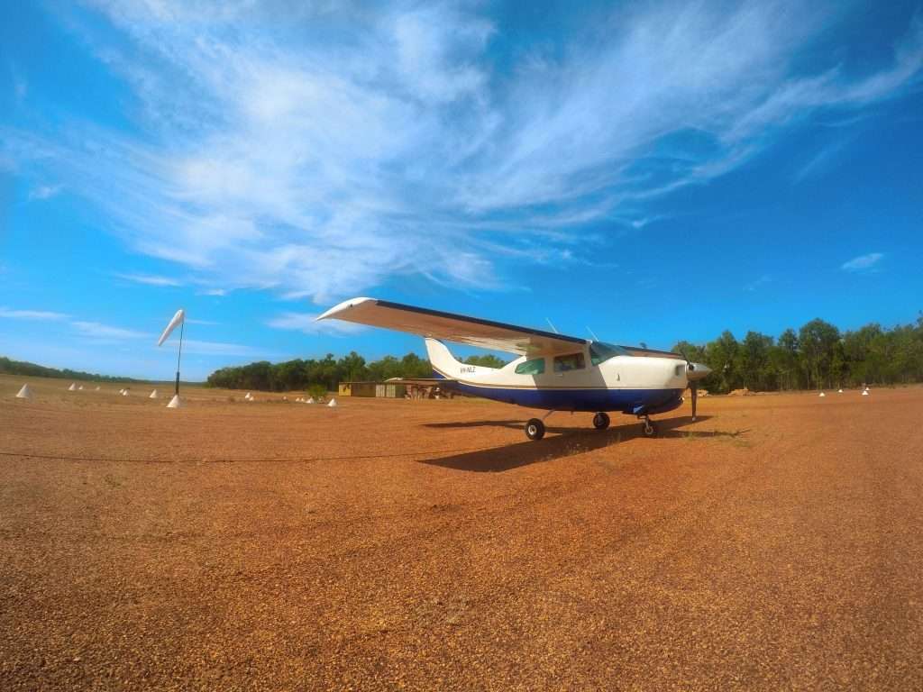 JFC Cessna 210 on a red-dirt outback airstrip in Western Australia